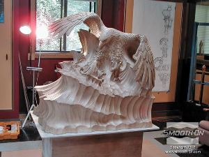 לחיצה להגדלת תמונה פסל העץ המקורי של דניס קולייר.